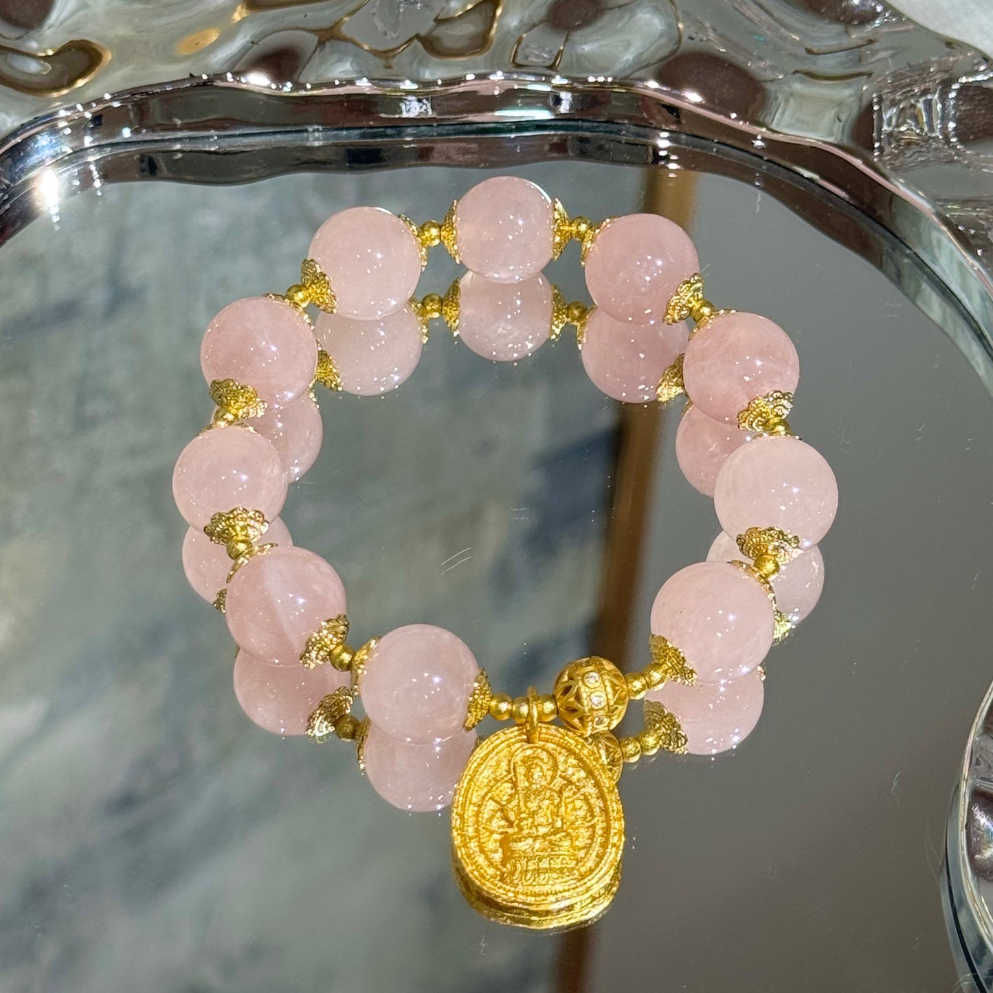 Rose quartz with buddha charm