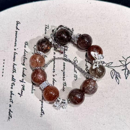 Golden black super seven with butterfly charm