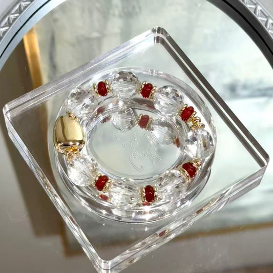 Facetted clear quartz with red agate