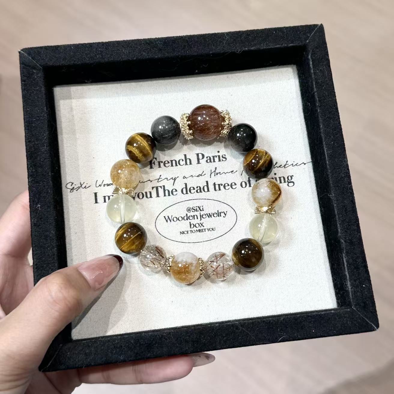 Golden black super 7 with tiger eye