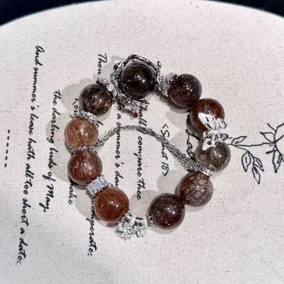 Golden black super seven with butterfly charm